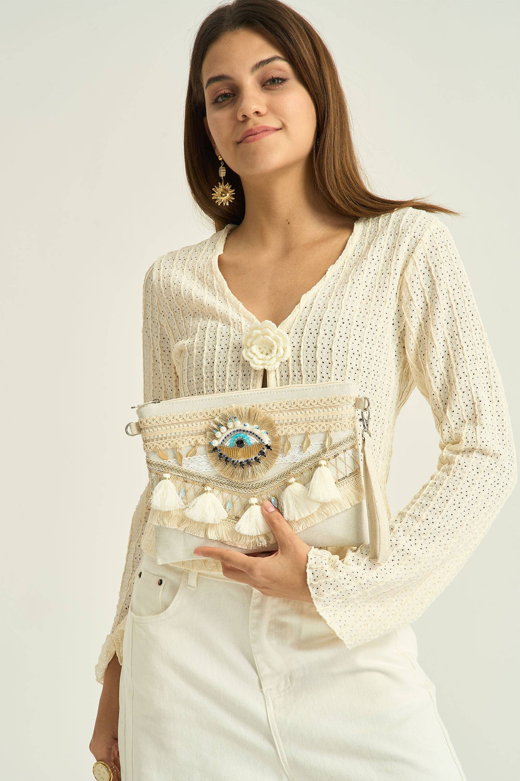 Pochette bohème beige brodée oeil protecteur avec pompons