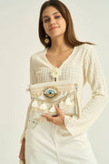 Pochette bohème beige brodée oeil protecteur avec pompons